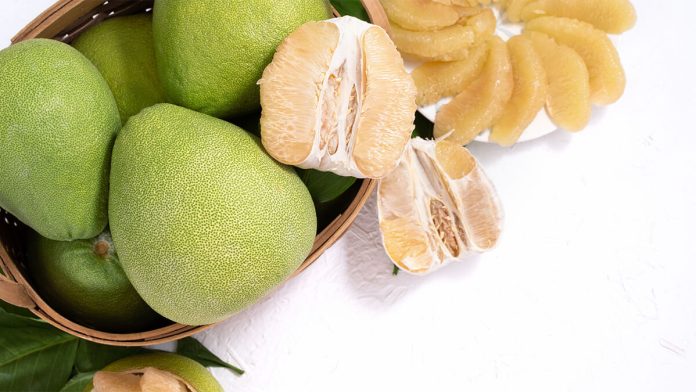 Fresh Pomelo Pummelo Grapefruit Shaddock White Cement Background Bamboo Basket Autumn Seasonal Fruit Top View Flat Lay Tabletop Shot
