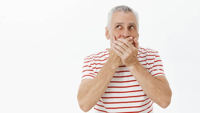 Shocked Senior Man Shut Mouth Concerned Looking Upper Left Corner (1)