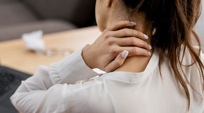 Young Woman Having Neckache While Working Home